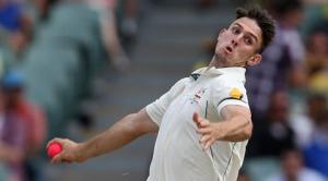 Australia's Mitchell Marsh bowls during their cricket test against New Zealand in Adelaide, Friday, Nov. 27, 2015. This match is the sport's first ever day-night test and the use of the experimental pink leather ball replacing the standard-issue red for the first time in a format that dates back to the 1870s. (AP Photo/Rick Rycroft)